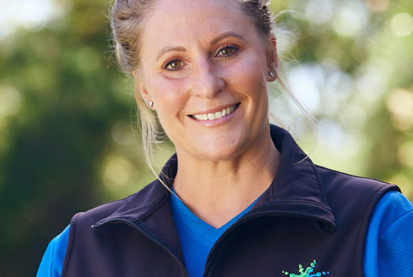 Portrait of Kim O’Donnell, GeckoSports owner and franchisor, smiling outdoors in uniform.