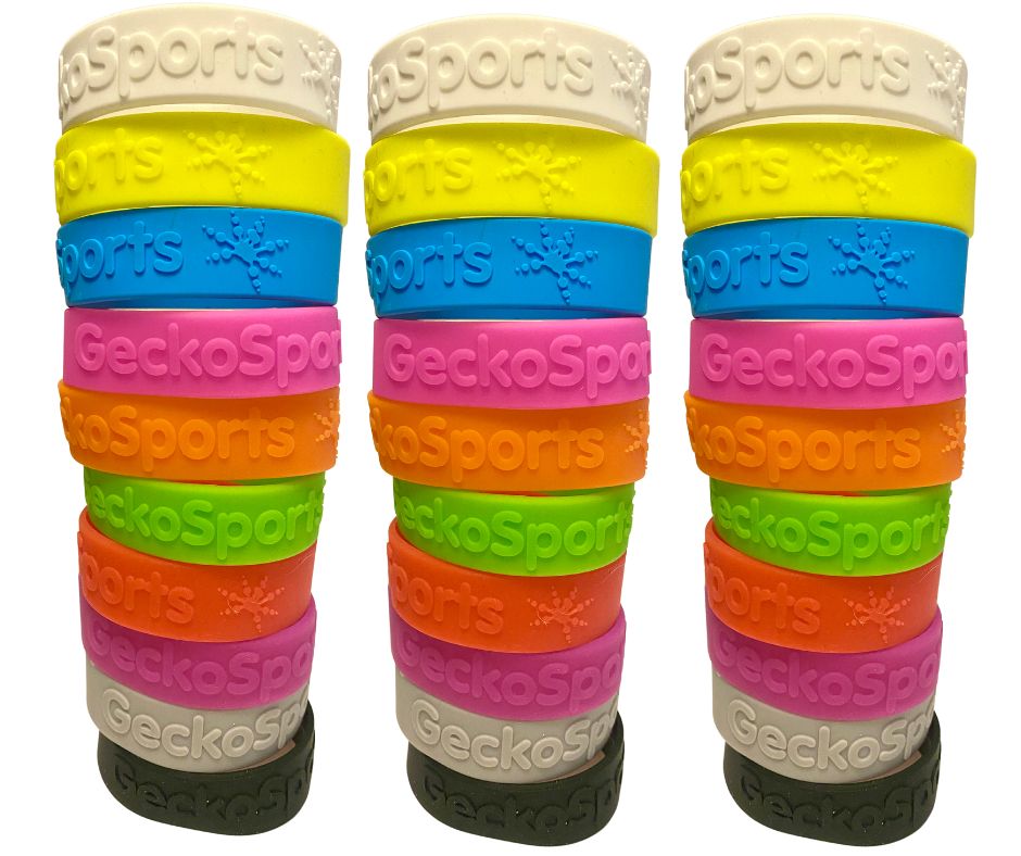 Three stacks of colourful GeckoSports silicone wristbands with the logo embossed.